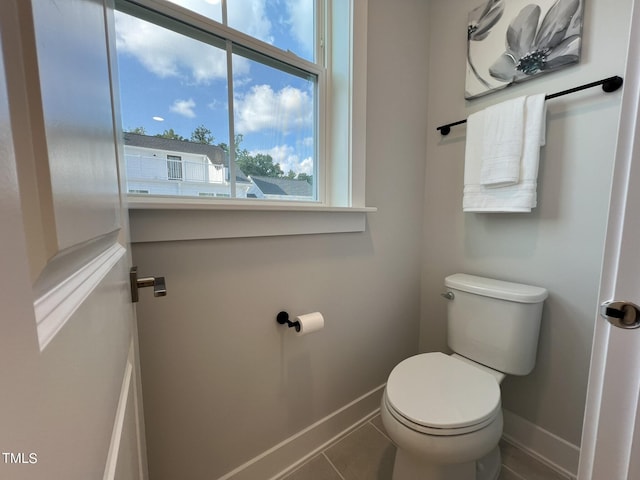 bathroom featuring tile patterned floors and toilet