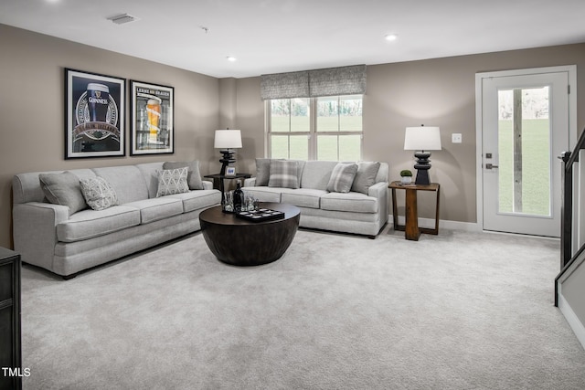 carpeted living room featuring a wealth of natural light