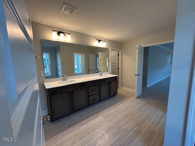 bathroom featuring vanity and hardwood / wood-style flooring