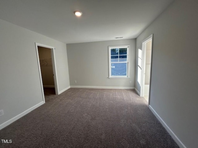 spare room featuring carpet floors