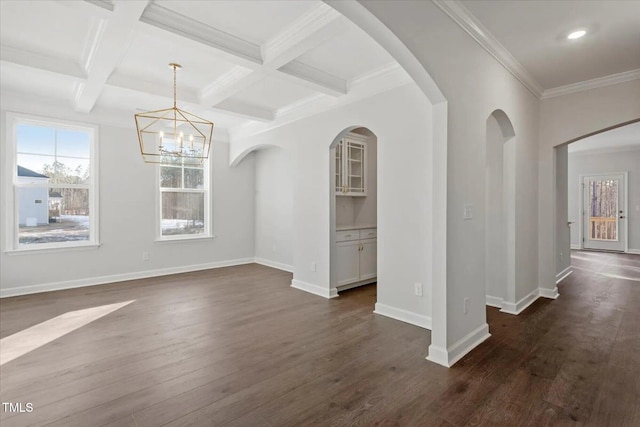 interior space with coffered ceiling, dark wood-type flooring, beamed ceiling, and crown molding