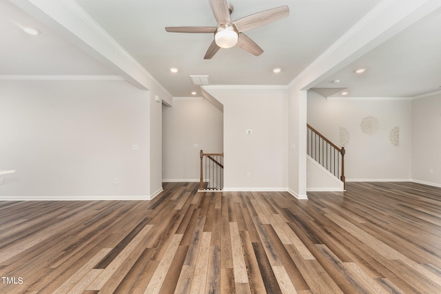 empty room featuring ceiling fan, crown molding, and wood-type flooring