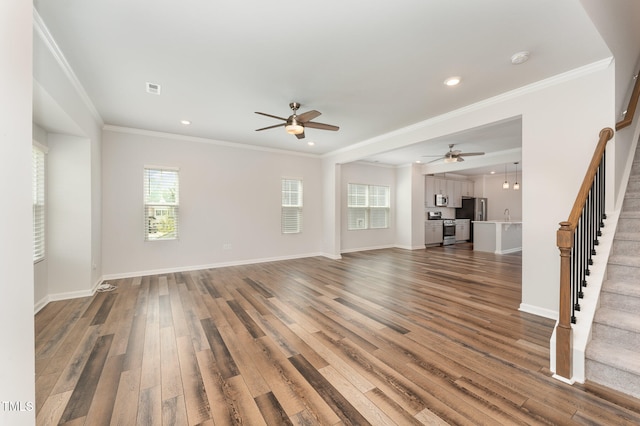 unfurnished living room featuring ceiling fan, crown molding, and wood-type flooring