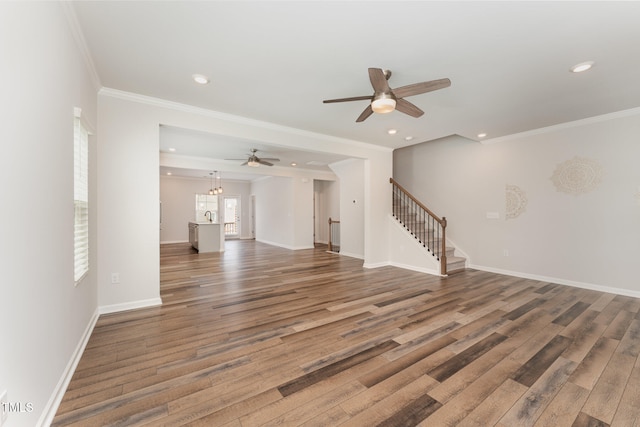 unfurnished living room featuring sink, ceiling fan, crown molding, and wood-type flooring