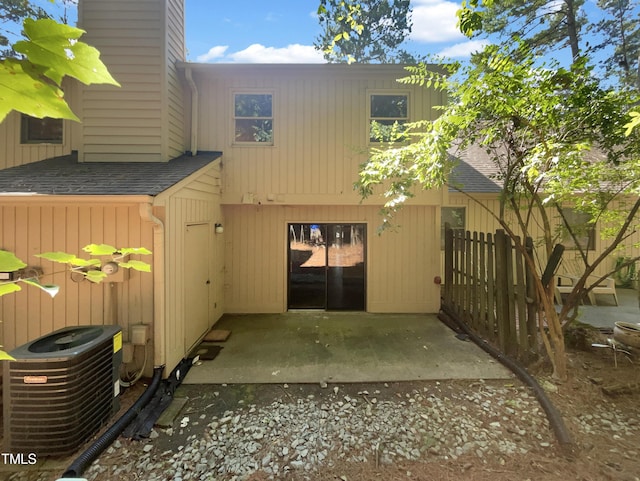 exterior space with cooling unit and a patio area