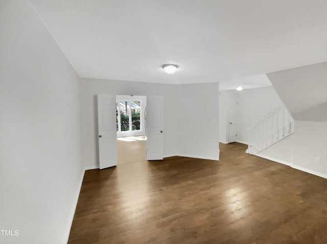 interior space with dark hardwood / wood-style flooring