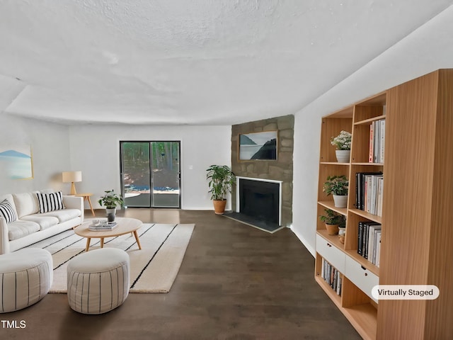 living area featuring a fireplace and wood finished floors