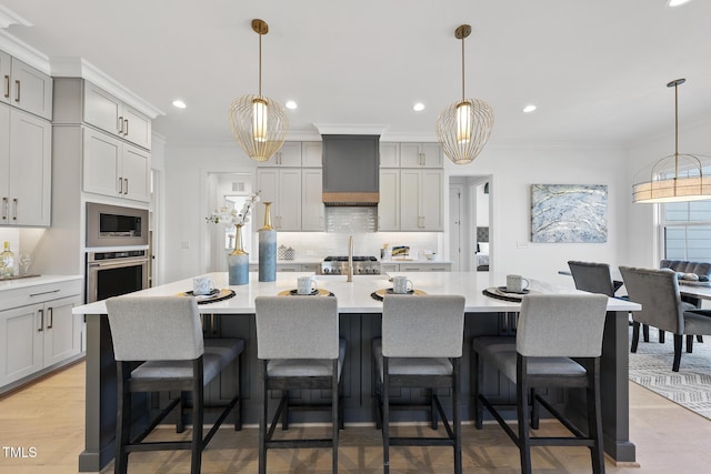 kitchen with crown molding, stainless steel appliances, light countertops, and custom range hood