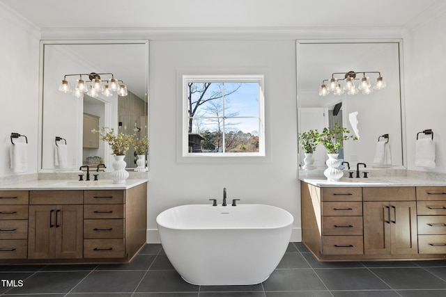 bathroom featuring ornamental molding, a sink, and tile patterned floors