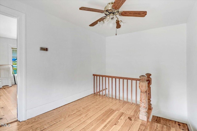 spare room featuring ceiling fan and light hardwood / wood-style floors