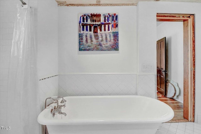 bathroom featuring tile patterned floors and shower with separate bathtub