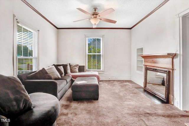 living room with a textured ceiling, carpet flooring, ceiling fan, and ornamental molding