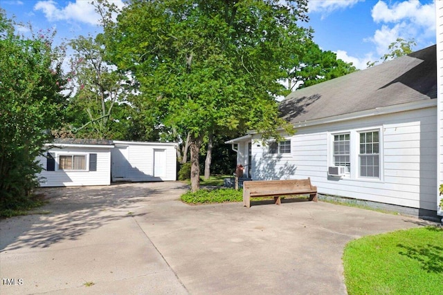 exterior space featuring a storage unit