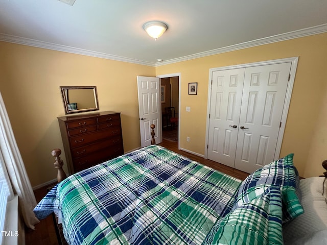 bedroom featuring a closet, crown molding, and hardwood / wood-style flooring