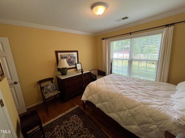 bedroom with crown molding and wood-type flooring