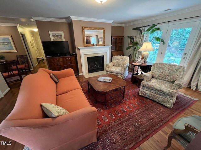 living room featuring hardwood / wood-style flooring and ornamental molding