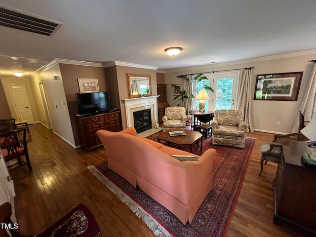 living room featuring crown molding and hardwood / wood-style floors