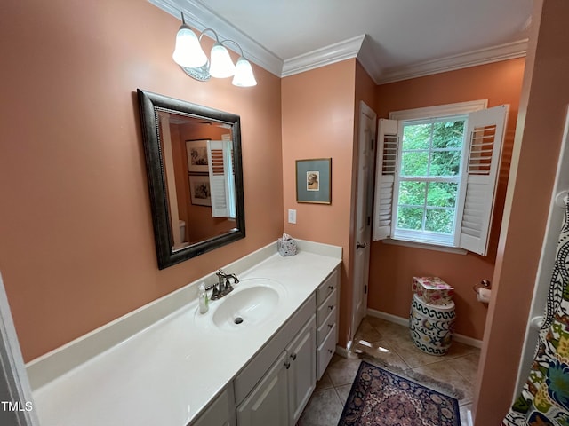 bathroom with tile patterned flooring, crown molding, and vanity