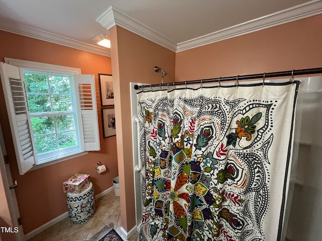 bathroom with crown molding, toilet, and tile patterned floors