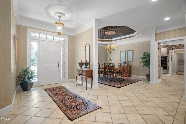 foyer entrance featuring ornamental molding, light tile patterned flooring, and baseboards