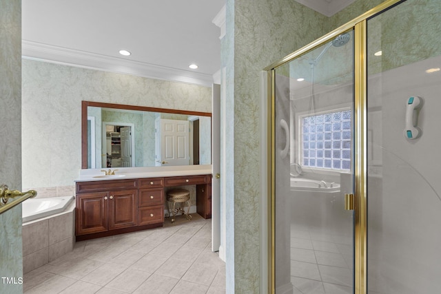 bathroom featuring a garden tub, crown molding, a shower stall, and vanity