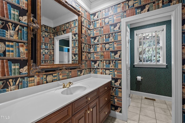 bathroom with crown molding, baseboards, visible vents, and wallpapered walls