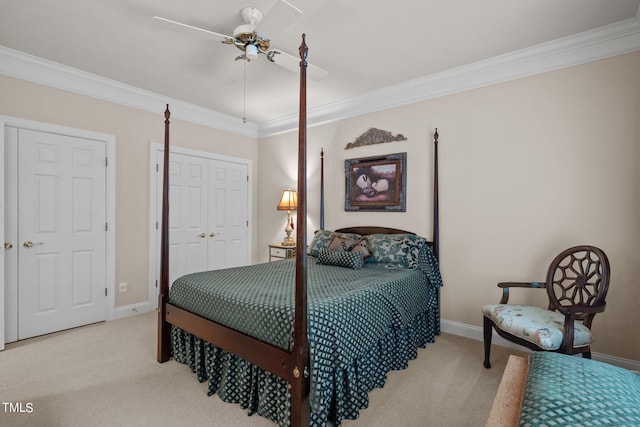 bedroom featuring light carpet, a ceiling fan, baseboards, and crown molding