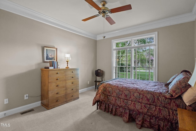 bedroom with light carpet, a ceiling fan, visible vents, baseboards, and ornamental molding