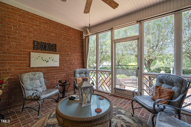 sunroom featuring ceiling fan