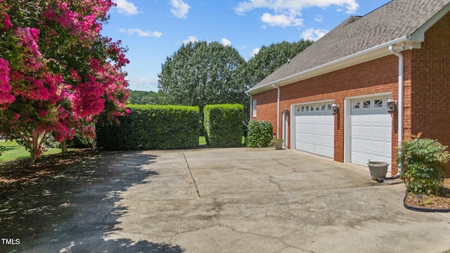 garage with concrete driveway