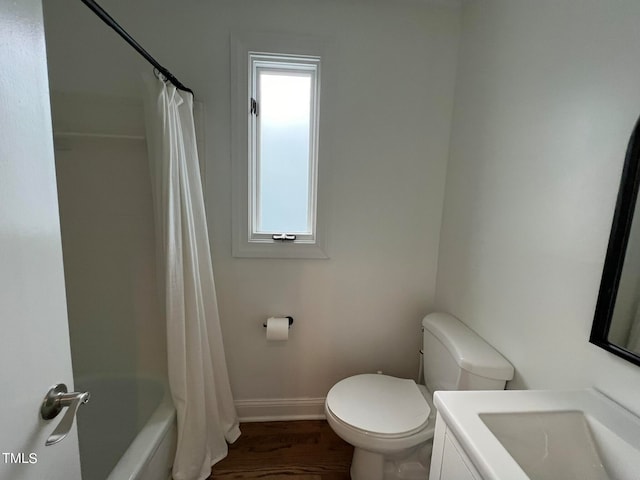 full bathroom with vanity, toilet, hardwood / wood-style floors, and shower / bath combo