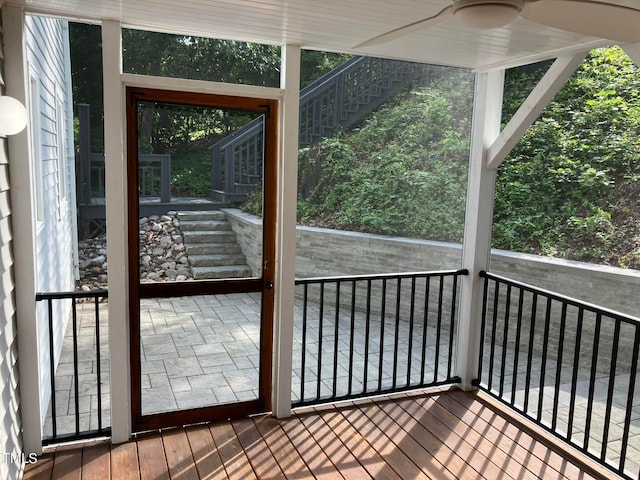 interior space featuring hardwood / wood-style floors and ceiling fan