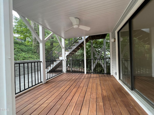 wooden deck featuring ceiling fan