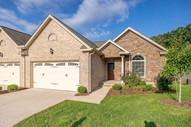 single story home with concrete driveway, stone siding, an attached garage, a front lawn, and brick siding