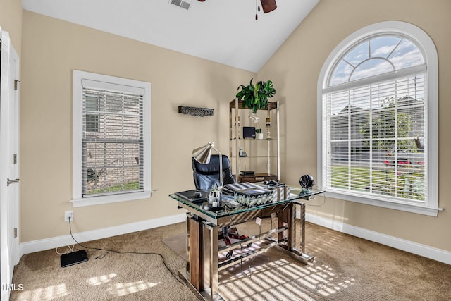 office featuring a ceiling fan, a wealth of natural light, lofted ceiling, and baseboards