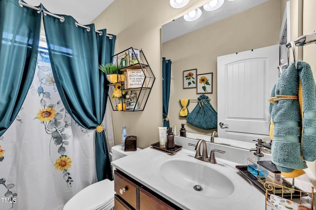 full bathroom featuring vanity and toilet