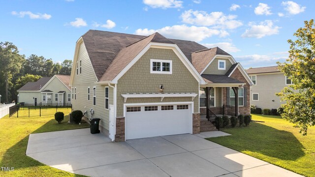 craftsman-style house with a garage and a front yard