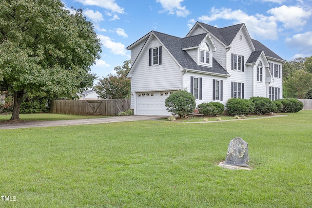 view of front facade featuring a front yard and a garage