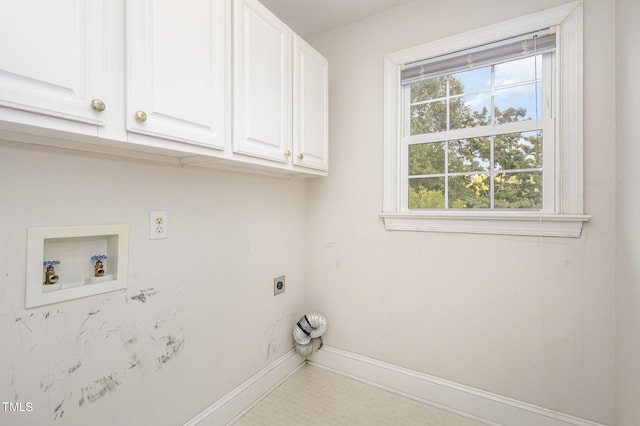 laundry area featuring hookup for a washing machine, cabinets, and electric dryer hookup