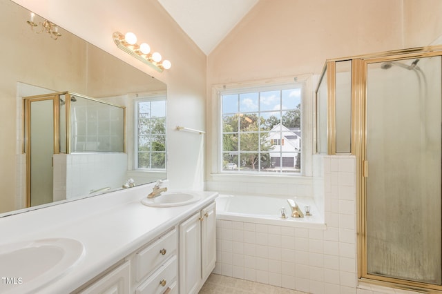 bathroom featuring tile patterned flooring, separate shower and tub, vaulted ceiling, and vanity