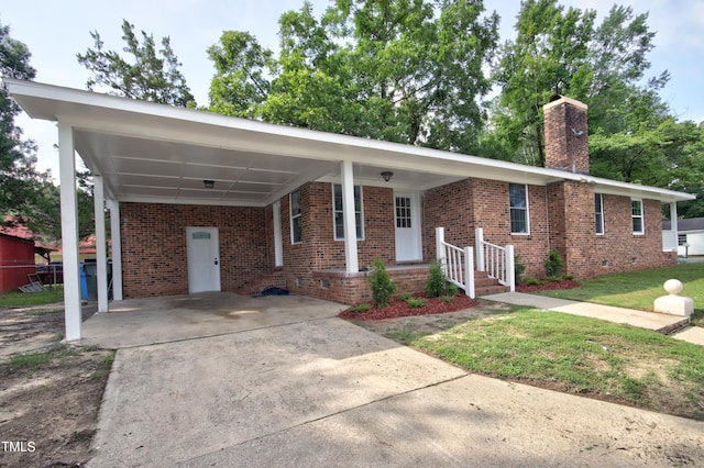 ranch-style home featuring a carport and a front yard