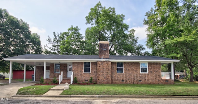 single story home with a front yard and a carport