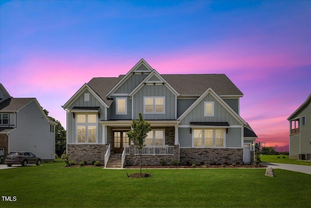 craftsman-style house featuring a yard and a porch