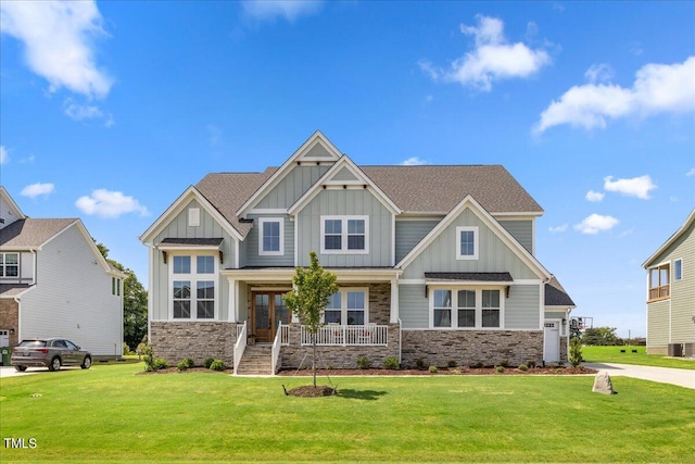 craftsman-style home featuring a front yard