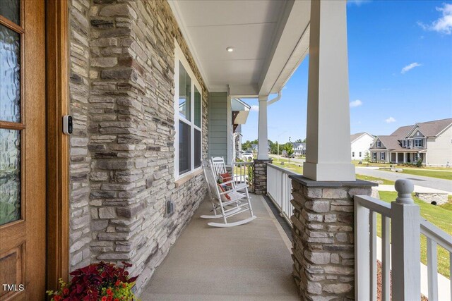 balcony featuring a porch