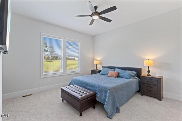 carpeted bedroom featuring ceiling fan