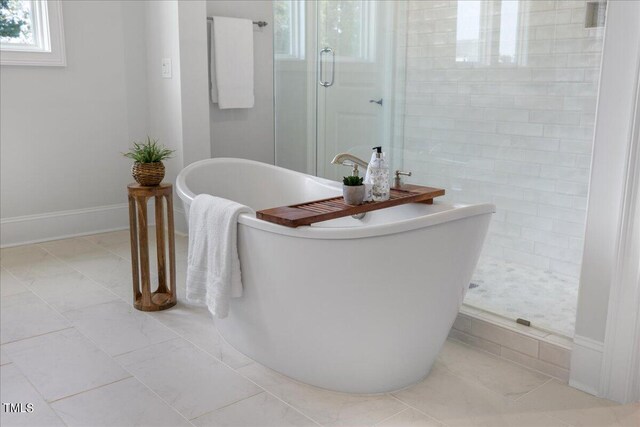 bathroom featuring independent shower and bath and tile patterned floors