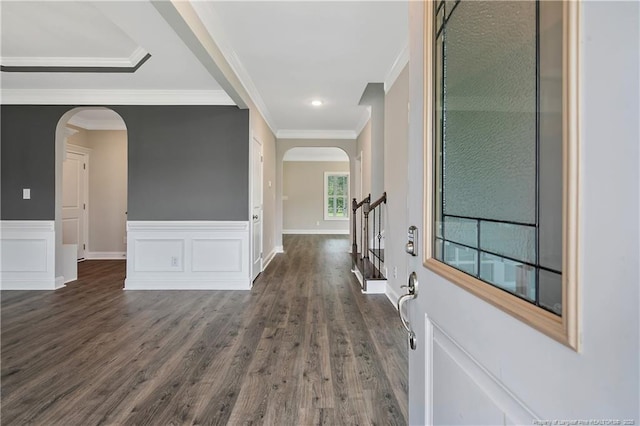 3113 Cragburn Pl, Fayetteville, NC 28306 - entryway featuring arched walkways, dark wood-style floors, crown molding, stairway, and a wainscoted wall
