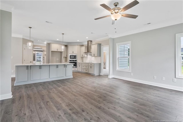 3113 Cragburn Pl, Fayetteville, NC 28306 - unfurnished living room featuring ornamental molding, baseboards, a ceiling fan, dark wood-type flooring, and recessed lighting