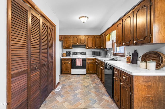 kitchen featuring dishwasher, white electric range, and sink